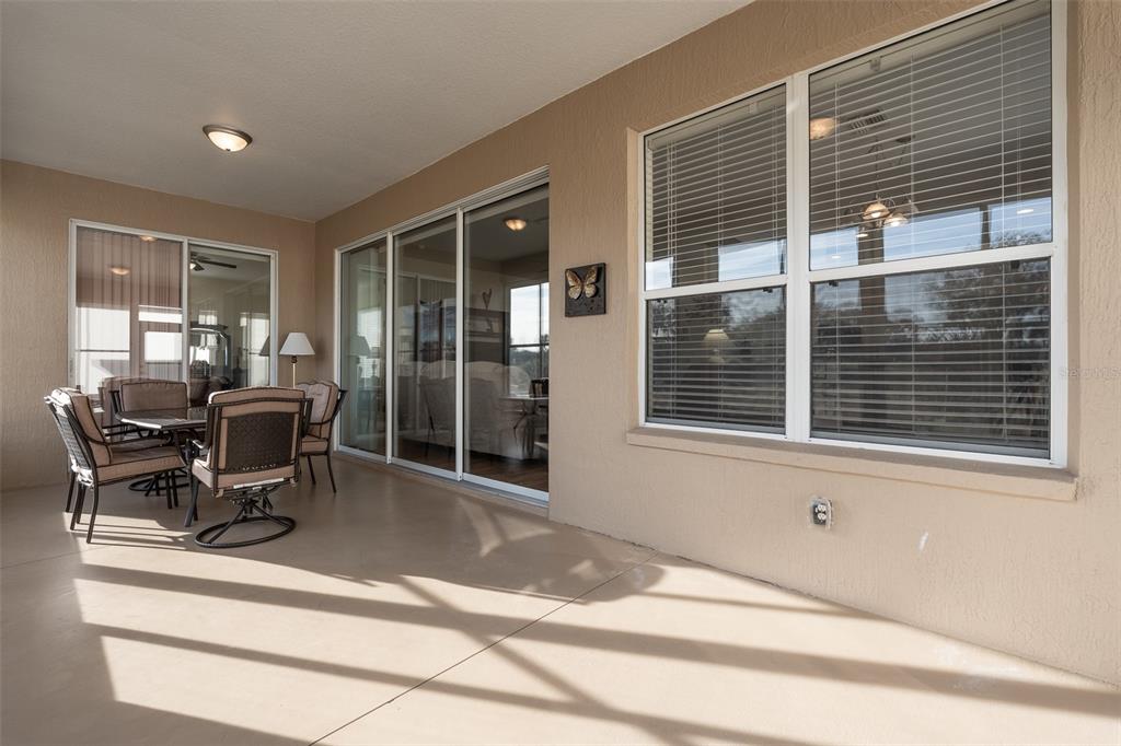 15803 Southwest 11th Court Road Ocala, FL 34473 - Photo 45 of 59 a dining room with a table and chairs