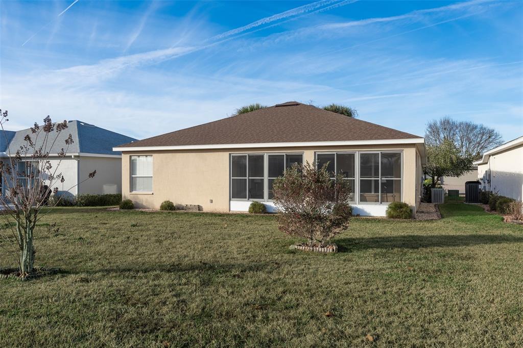 15803 Southwest 11th Court Road Ocala, FL 34473 - Photo 46 of 59 a front view of a house with a yard