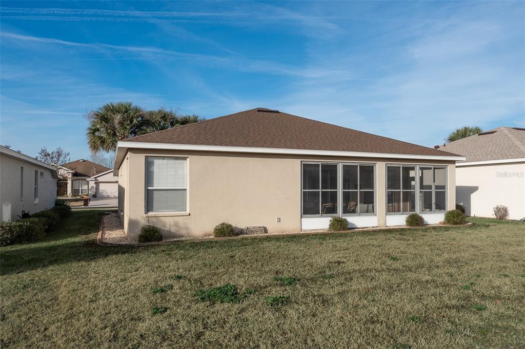 15803 Southwest 11th Court Road Ocala, FL 34473 - Photo 47 of 59 a front view of a house with a yard