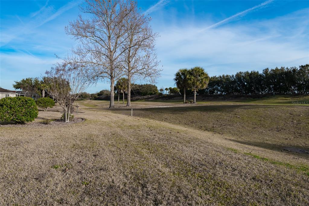 15803 Southwest 11th Court Road Ocala, FL 34473 - Photo 49 of 59 a view of outdoor space with green field and trees