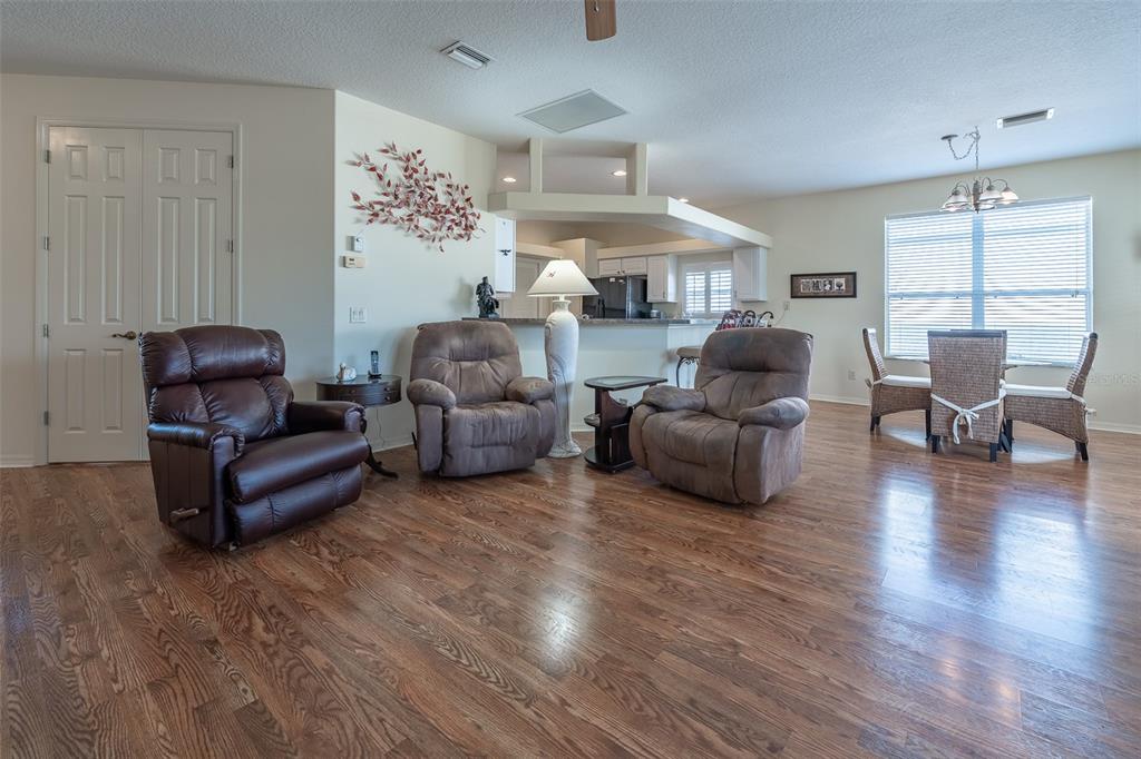 15803 Southwest 11th Court Road Ocala, FL 34473 - Photo 6 of 59 a living room with furniture and a wooden floor