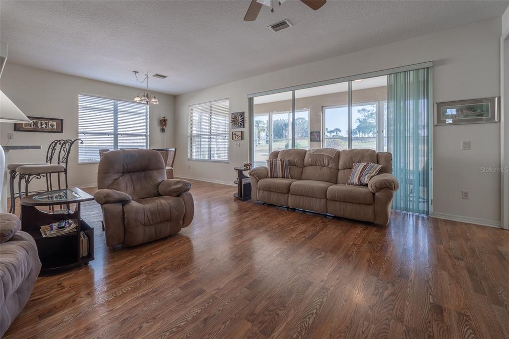 15803 Southwest 11th Court Road Ocala, FL 34473 - Photo 7 of 59 a living room with furniture and a large window