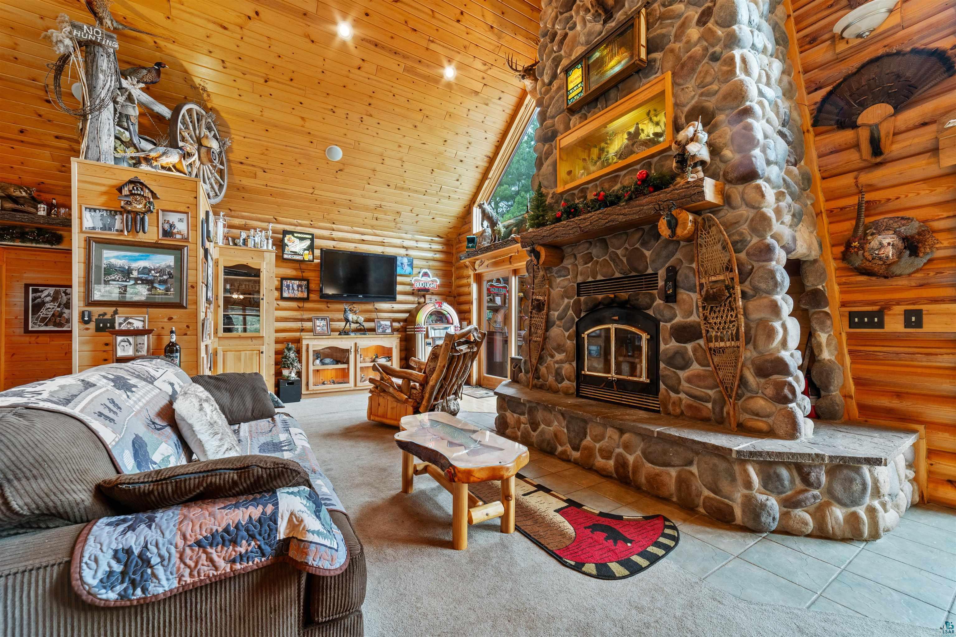11911 East Rowe Road Lake Nebagamon, WI 54849 - Photo 7 of 61 Stone-faced fireplace with hearth and built-in wood stove