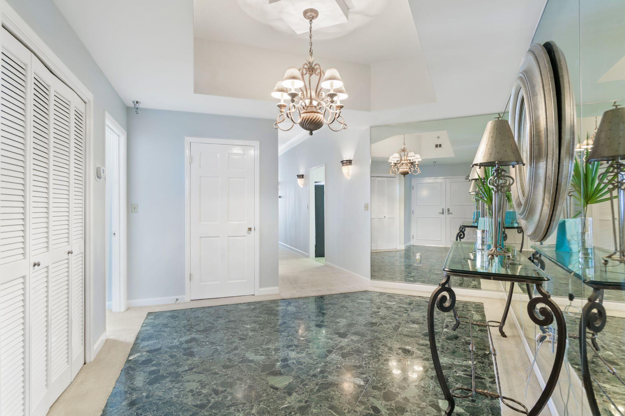 950 Highway 98, Unit 7101 Destin, FL 32541 - Photo 14 of 74 a view of an entryway with a chandelier