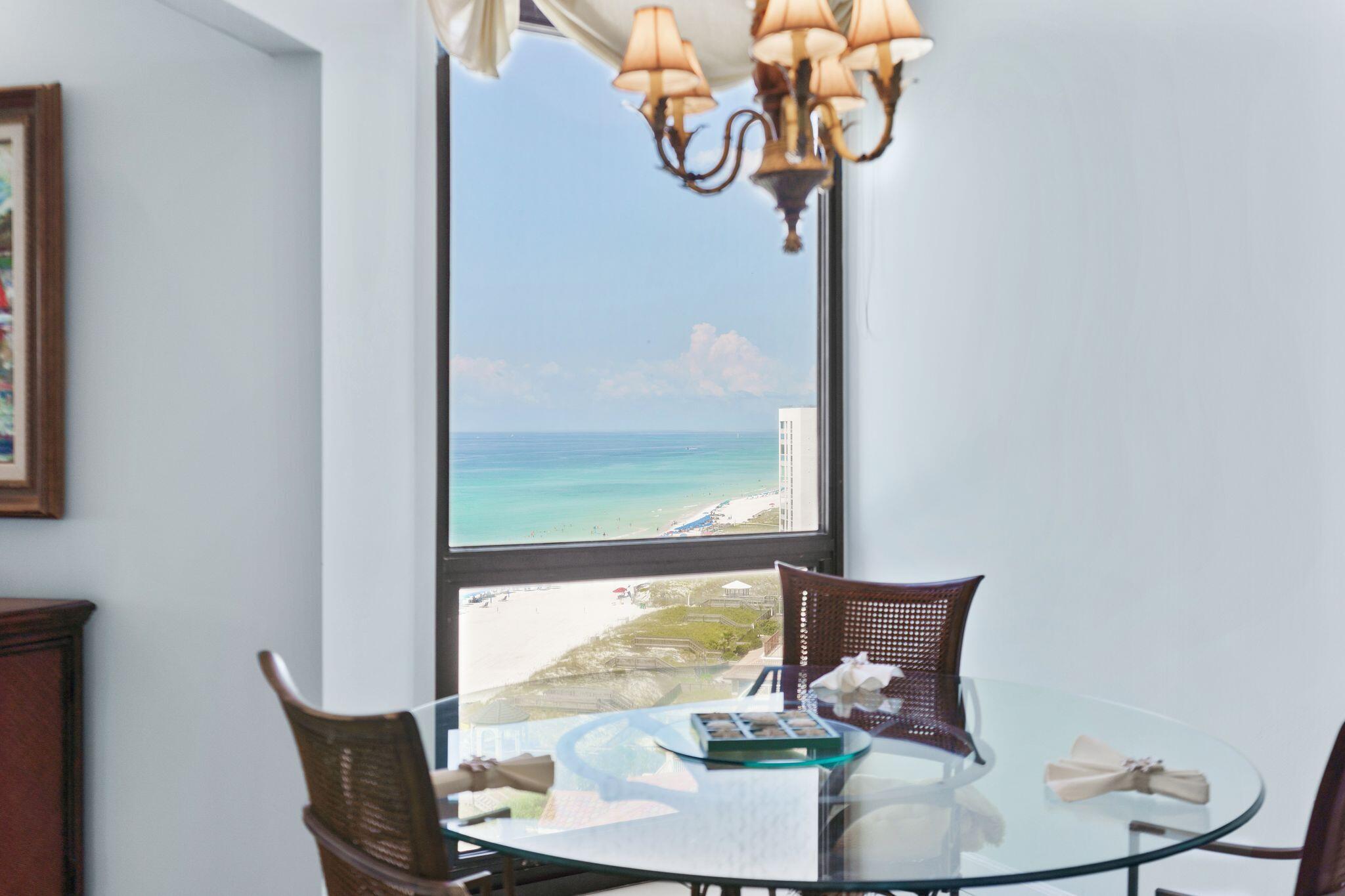 950 Highway 98, Unit 7101 Destin, FL 32541 - Photo 28 of 74 a view of a dining room with furniture water and chandelier