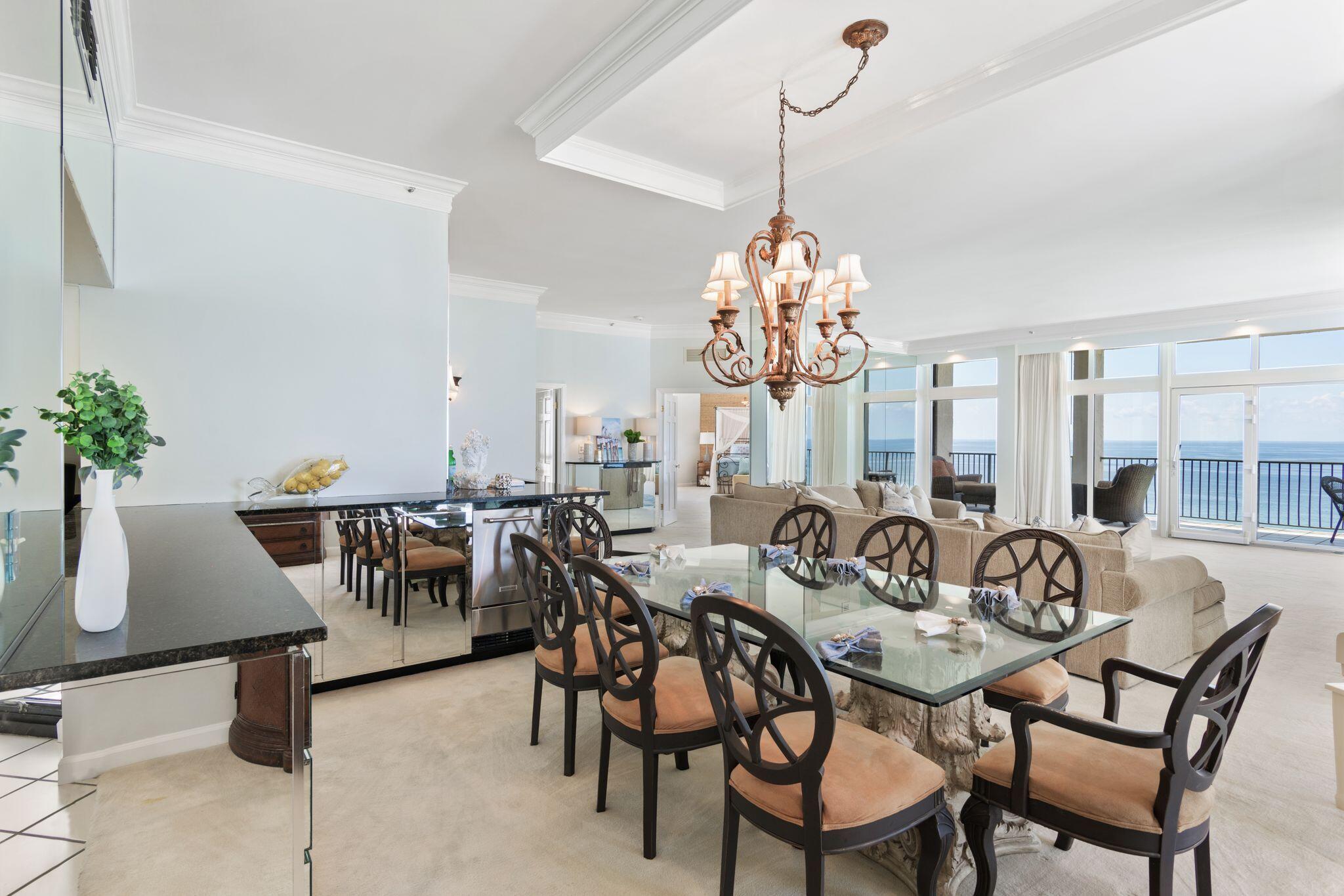 950 Highway 98, Unit 7101 Destin, FL 32541 - Photo 32 of 74 a view of a dining room with furniture and chandelier