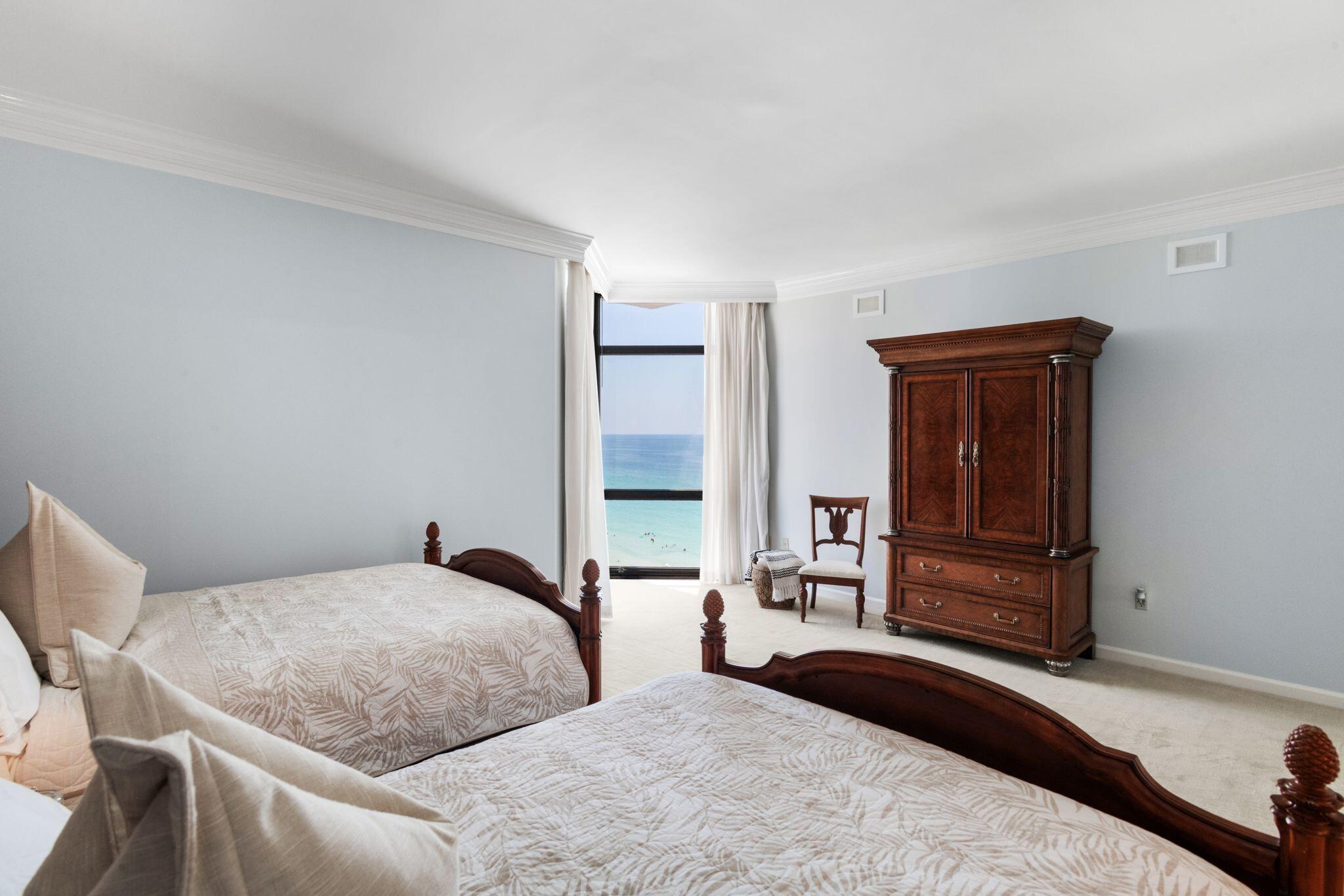 950 Highway 98, Unit 7101 Destin, FL 32541 - Photo 38 of 74 a bedroom with a large bed and two windows