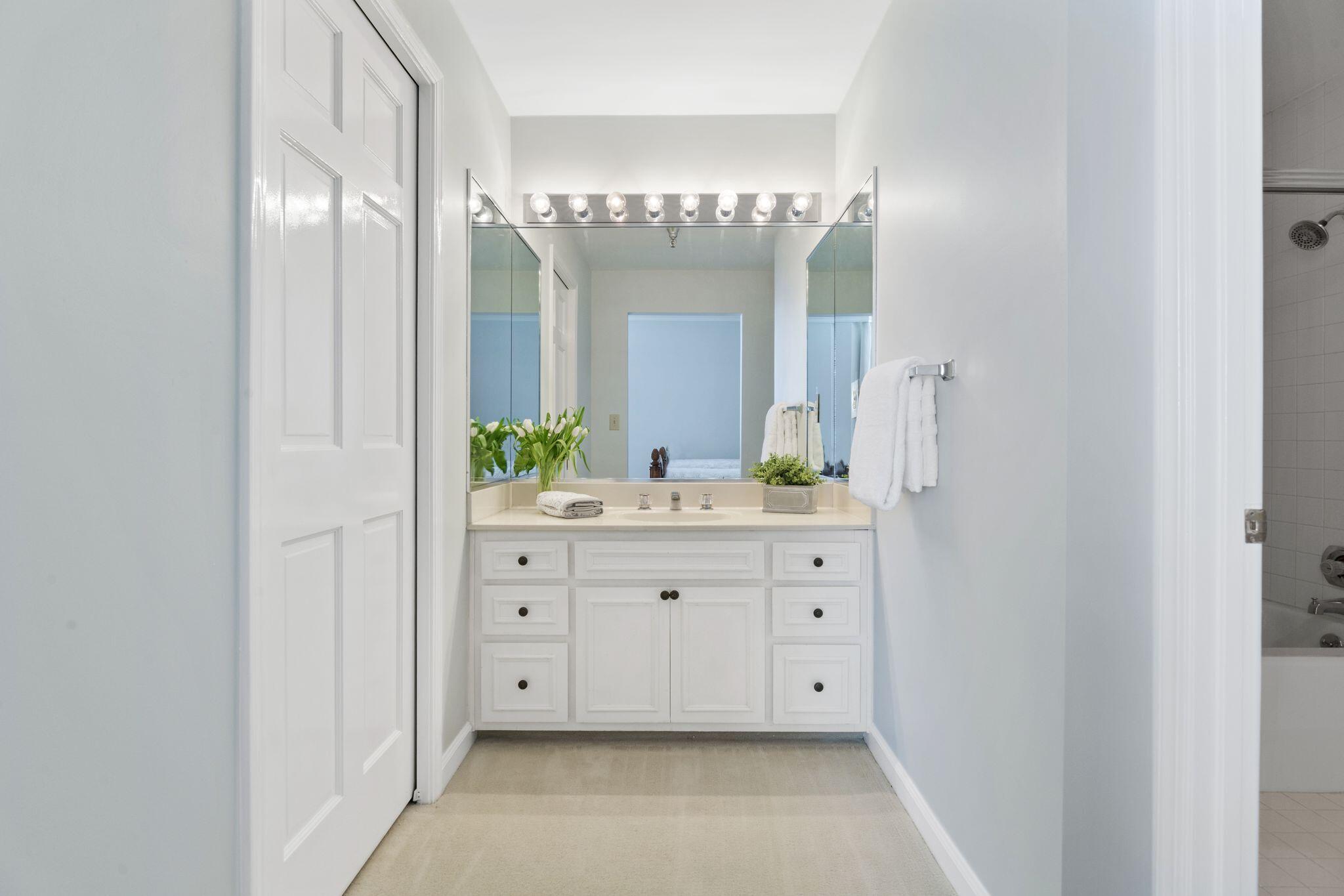950 Highway 98, Unit 7101 Destin, FL 32541 - Photo 40 of 74 a spacious bathroom with a double vanity sink and a mirror