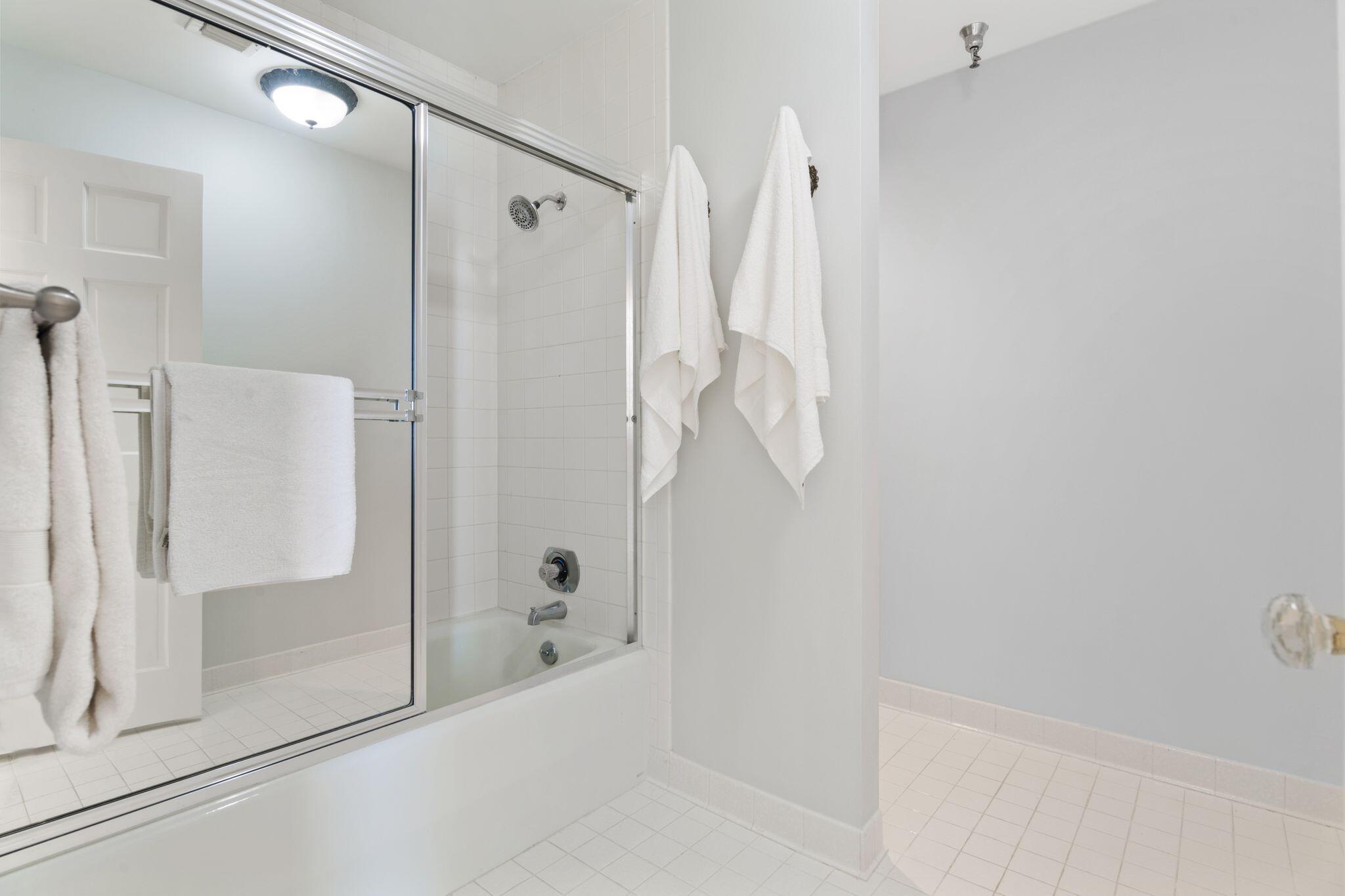 950 Highway 98, Unit 7101 Destin, FL 32541 - Photo 41 of 74 a bathroom with a shower and a tub