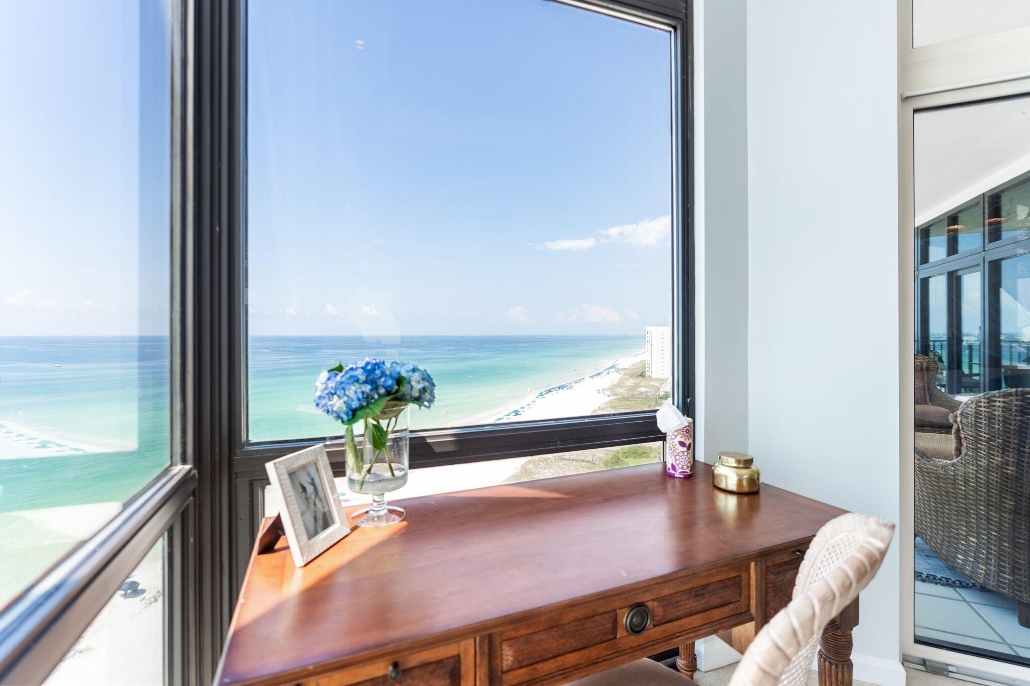 950 Highway 98, Unit 7101 Destin, FL 32541 - Photo 44 of 74 a view of a dining room with furniture window and wooden floor