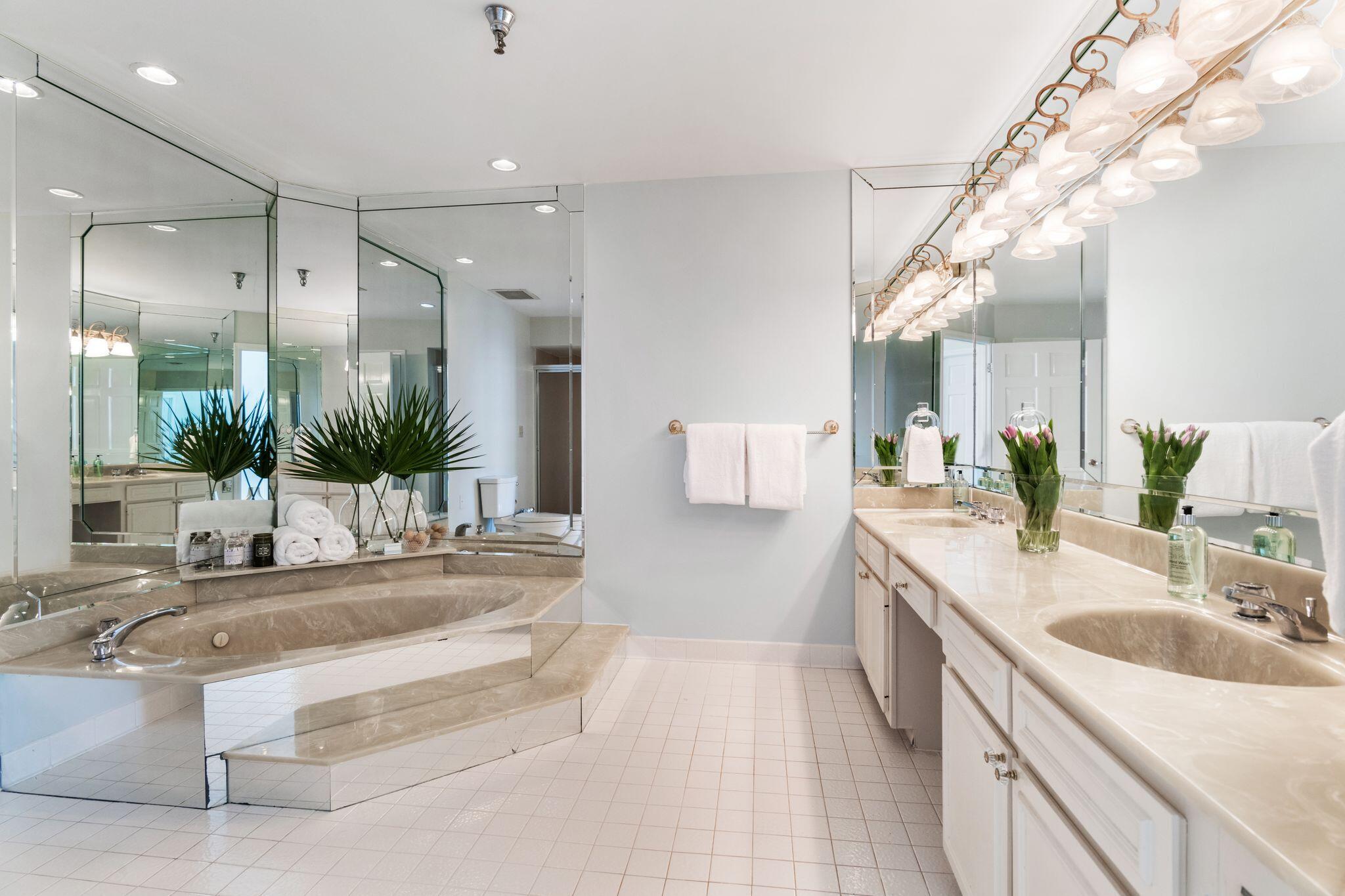950 Highway 98, Unit 7101 Destin, FL 32541 - Photo 47 of 74 a spacious bathroom with a sink and a large mirror