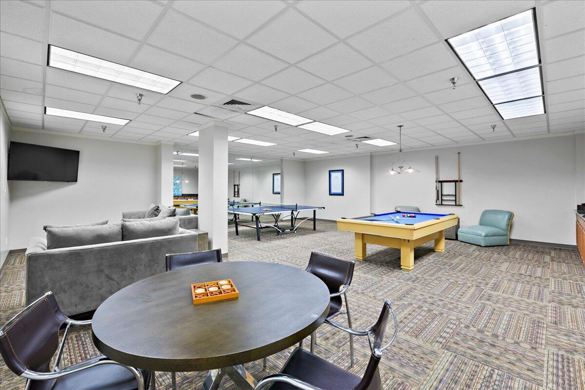 950 Highway 98, Unit 7101 Destin, FL 32541 - Photo 59 of 74 a living room with furniture a table and a pool table