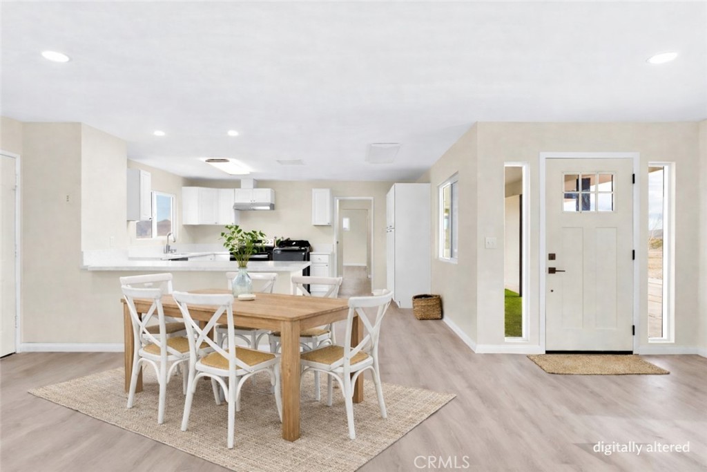 47424 Paddington Landers, CA 92285 - Photo 11 of 67 a dining room with furniture and a kitchen view