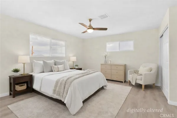 an empty room with wooden floor and fireplace