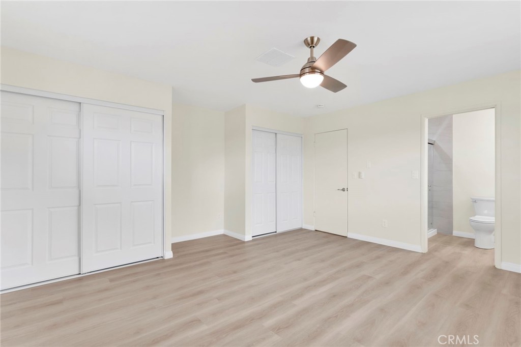 47424 Paddington Landers, CA 92285 - Photo 20 of 67 a view of empty room with wooden floor and ceiling fan