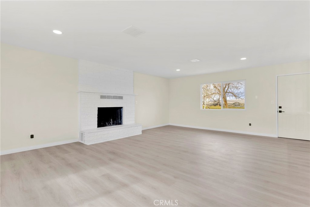 47424 Paddington Landers, CA 92285 - Photo 53 of 67 a view of an empty room with a fireplace
