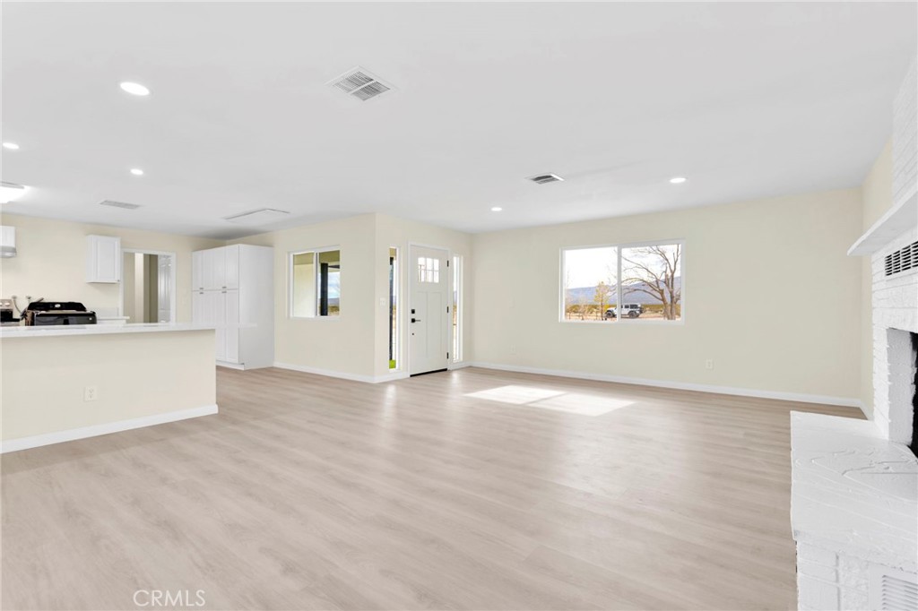 47424 Paddington Landers, CA 92285 - Photo 55 of 67 a view of an empty room with a window and wooden floor