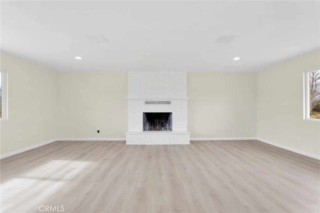 47424 Paddington Landers, CA 92285 - Photo 63 of 67 a view of an empty room with a fireplace and a window
