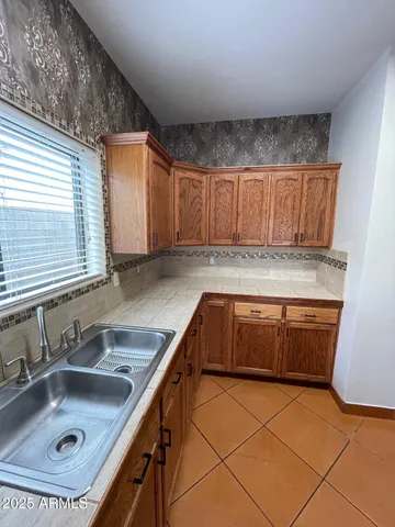 a kitchen with a sink and cabinets