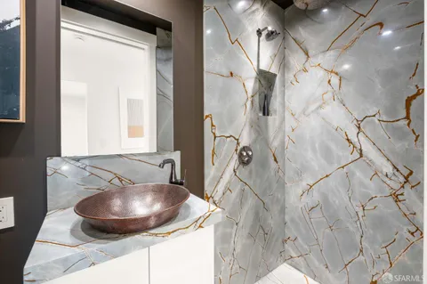 a bathroom with a sink and a mirror