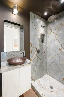 a bathroom with a sink and a mirror