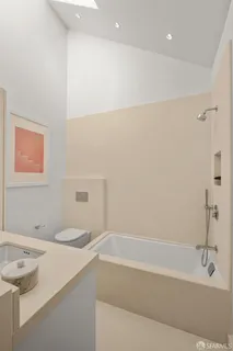 a bathroom with a bathtub and a sink