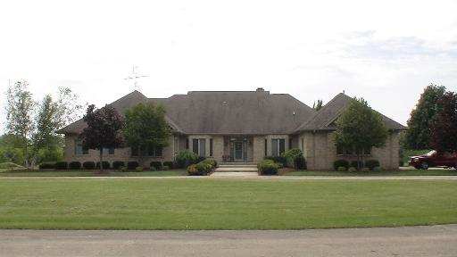 12085 Base Line Road Kingston, IL 60145 - Photo 1 of 1 a front view of a house with a yard