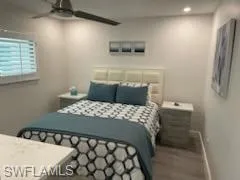 a bedroom with a bed and a tv