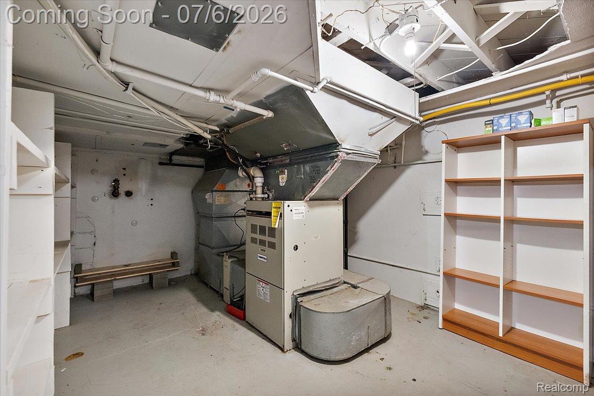 1051 Devonshire Road Grosse Pointe, MI 48230 - Photo 67 of 98 Basement utility area featuring a furnace system, exposed ceiling joists, and concrete flooring
