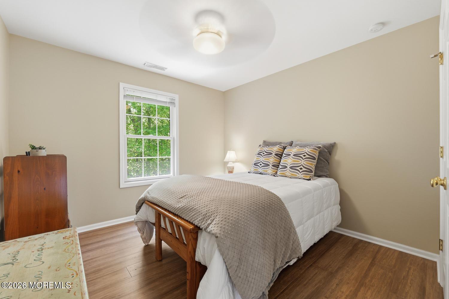 7 Cherry Tree Lane Cream Ridge, NJ 08514 - Photo 29 of 47 a bedroom with a bed and wooden floor