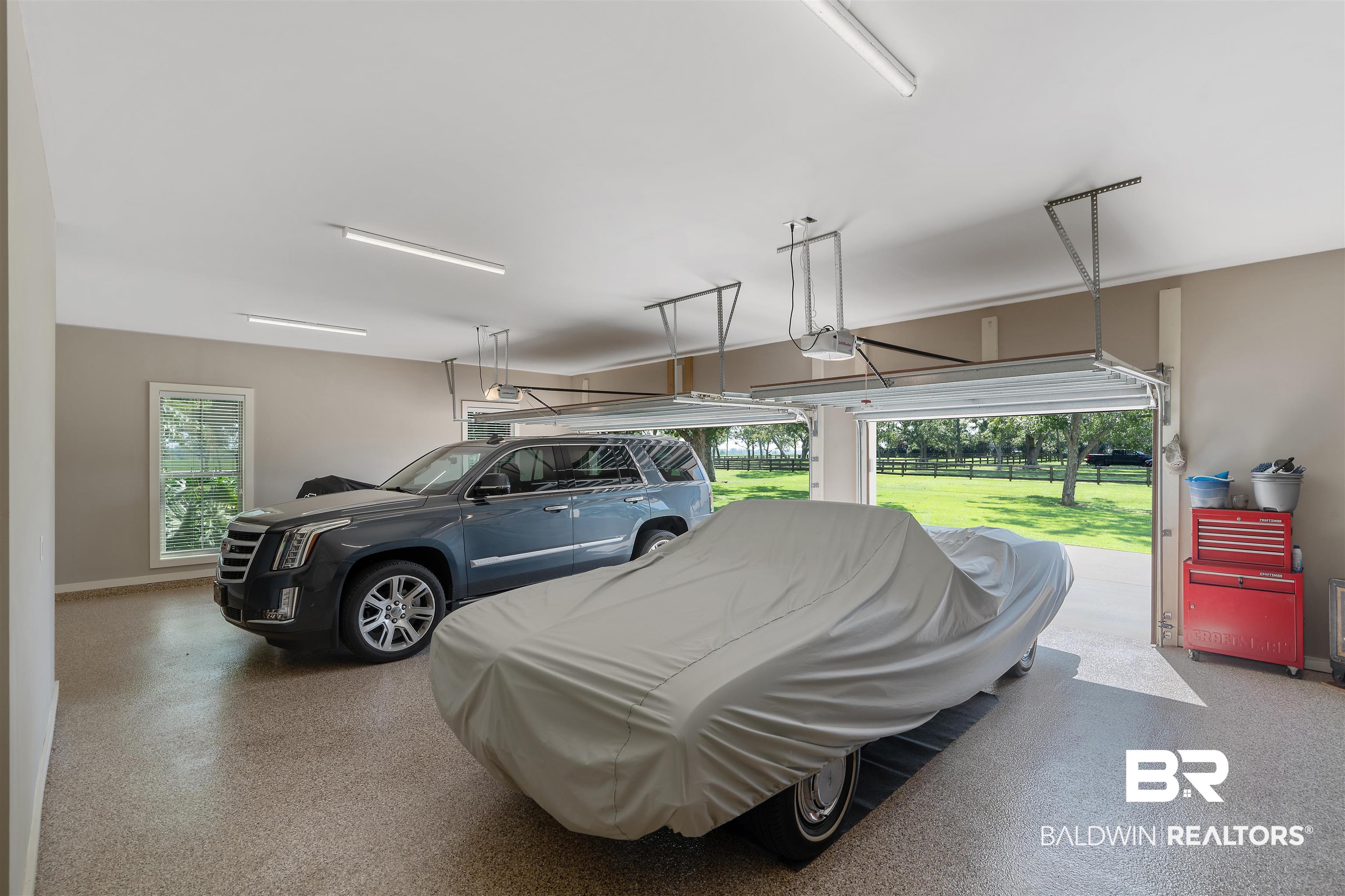 8753 Bishop Road Fairhope, AL 36532 - Photo 45 of 59 Spacious two-car garage featuring an epoxy-coated concrete floor, two automatic garage door openers, and recessed lighting