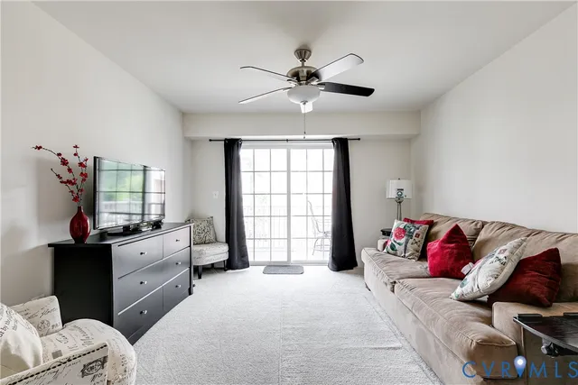 a spacious bedroom with a bed and a chandelier