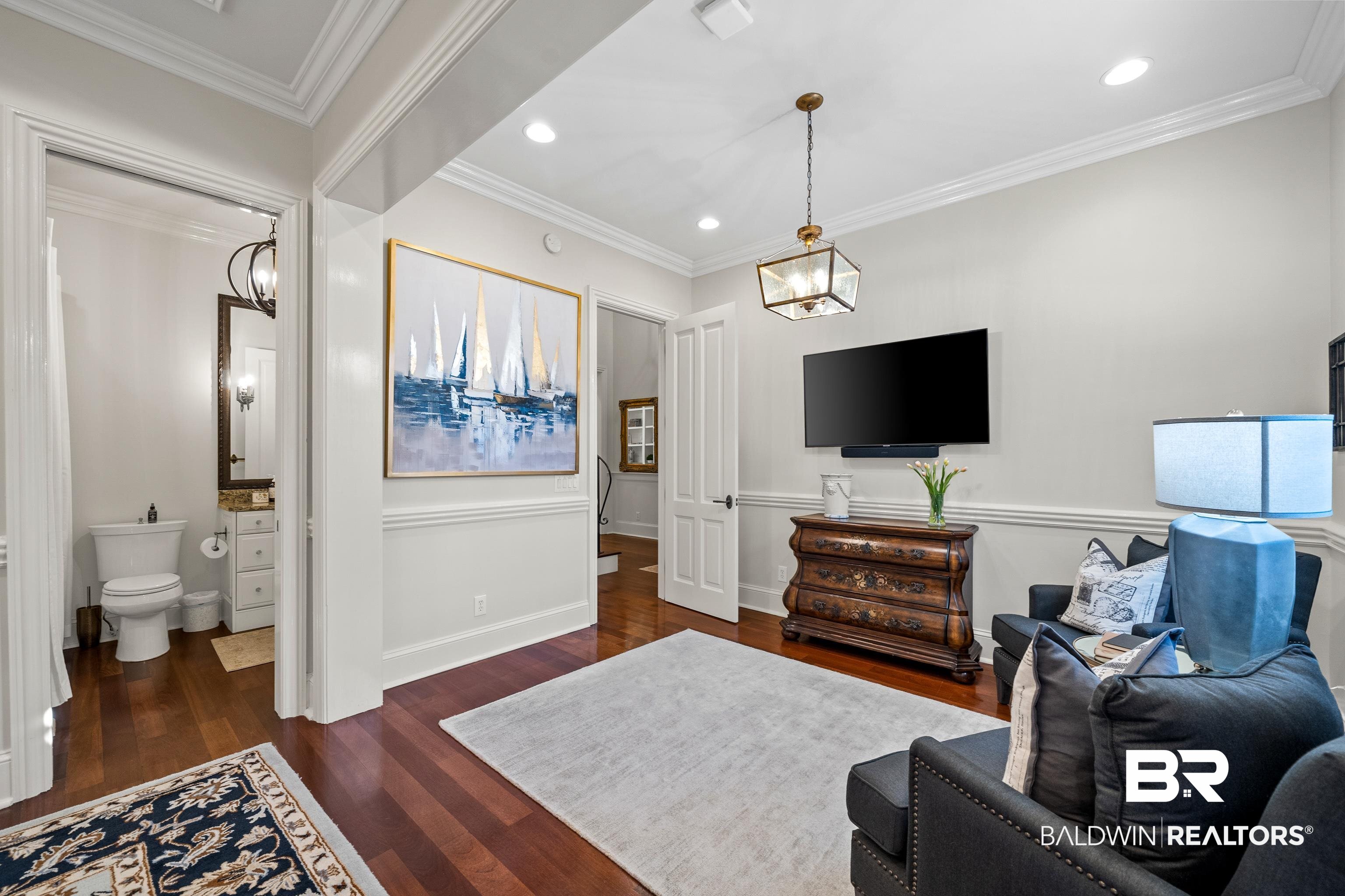 3613 Old Park Road Gulf Shores, AL 36542 - Photo 30 of 72 Living area featuring baseboards, recessed lighting, dark wood finished floors, and crown molding