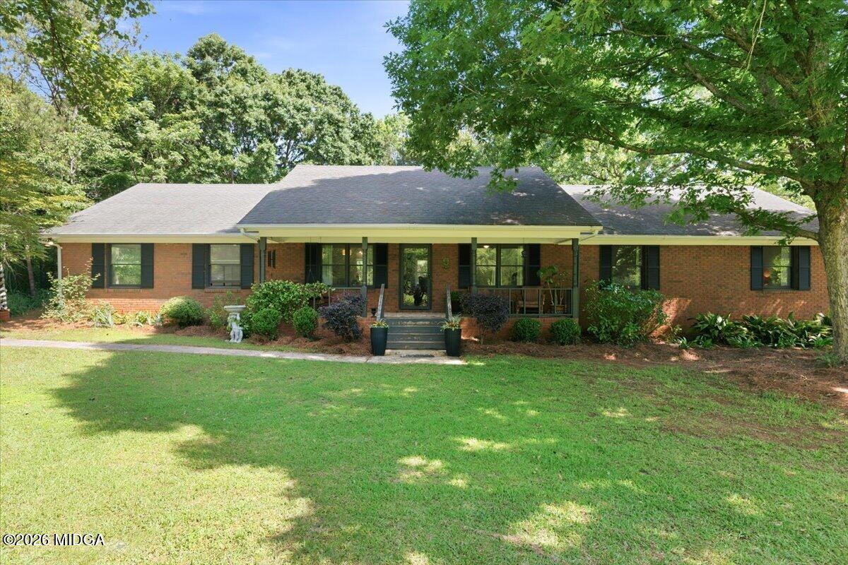 1608 Rumble Road Forsyth, GA 31029 - Photo 1 of 46 a front view of a house with garden