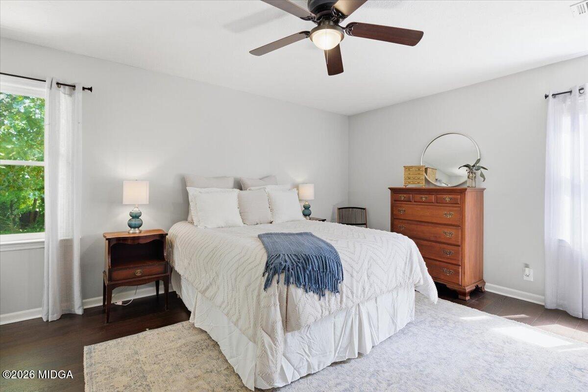 1608 Rumble Road Forsyth, GA 31029 - Photo 19 of 46 a bedroom with a bed and a chandelier