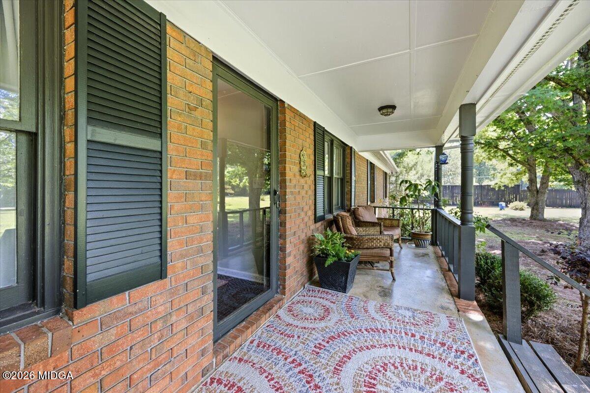 1608 Rumble Road Forsyth, GA 31029 - Photo 2 of 46 a balcony view with a potted plant and outdoor space
