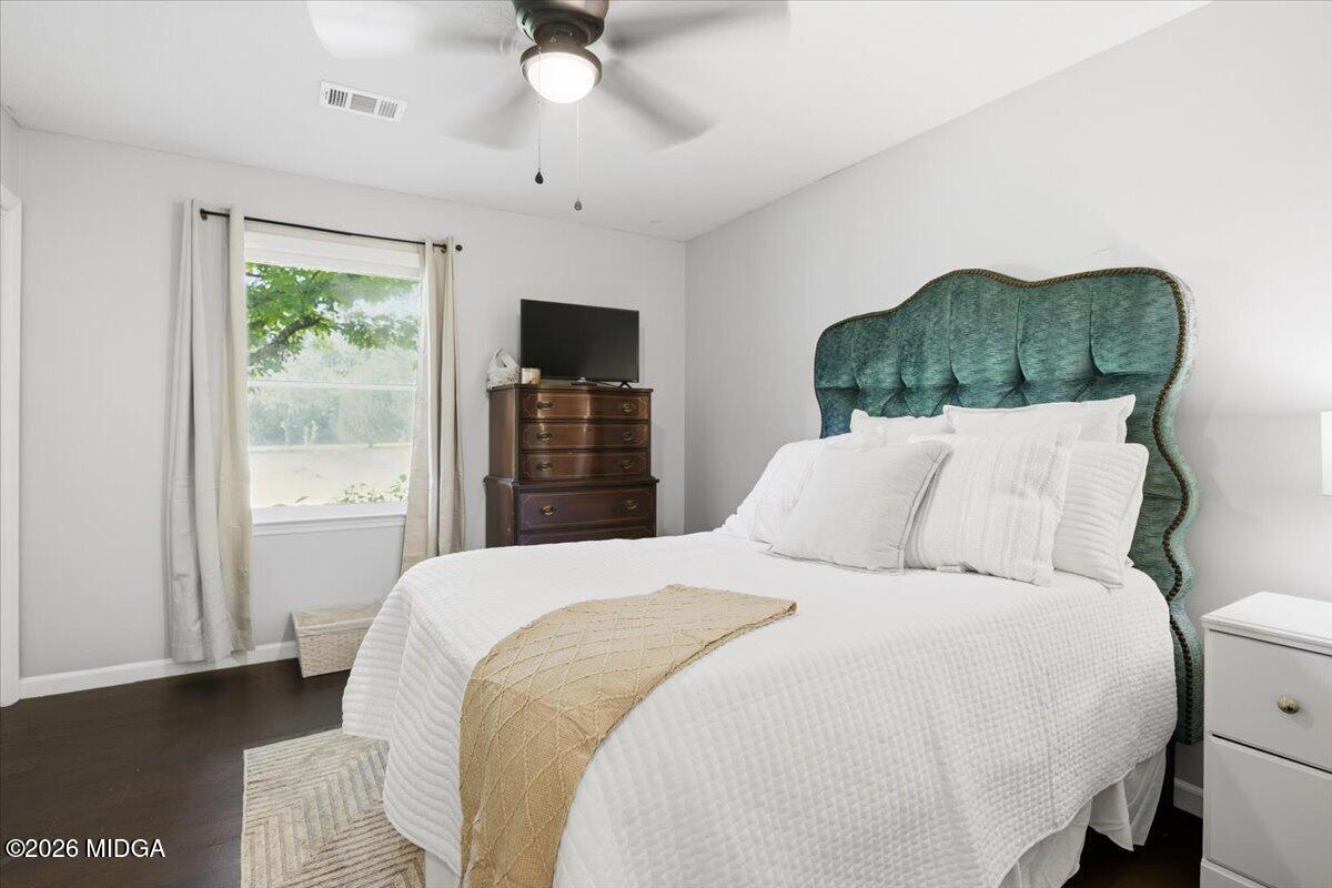 1608 Rumble Road Forsyth, GA 31029 - Photo 23 of 46 a bedroom with a bed and a television