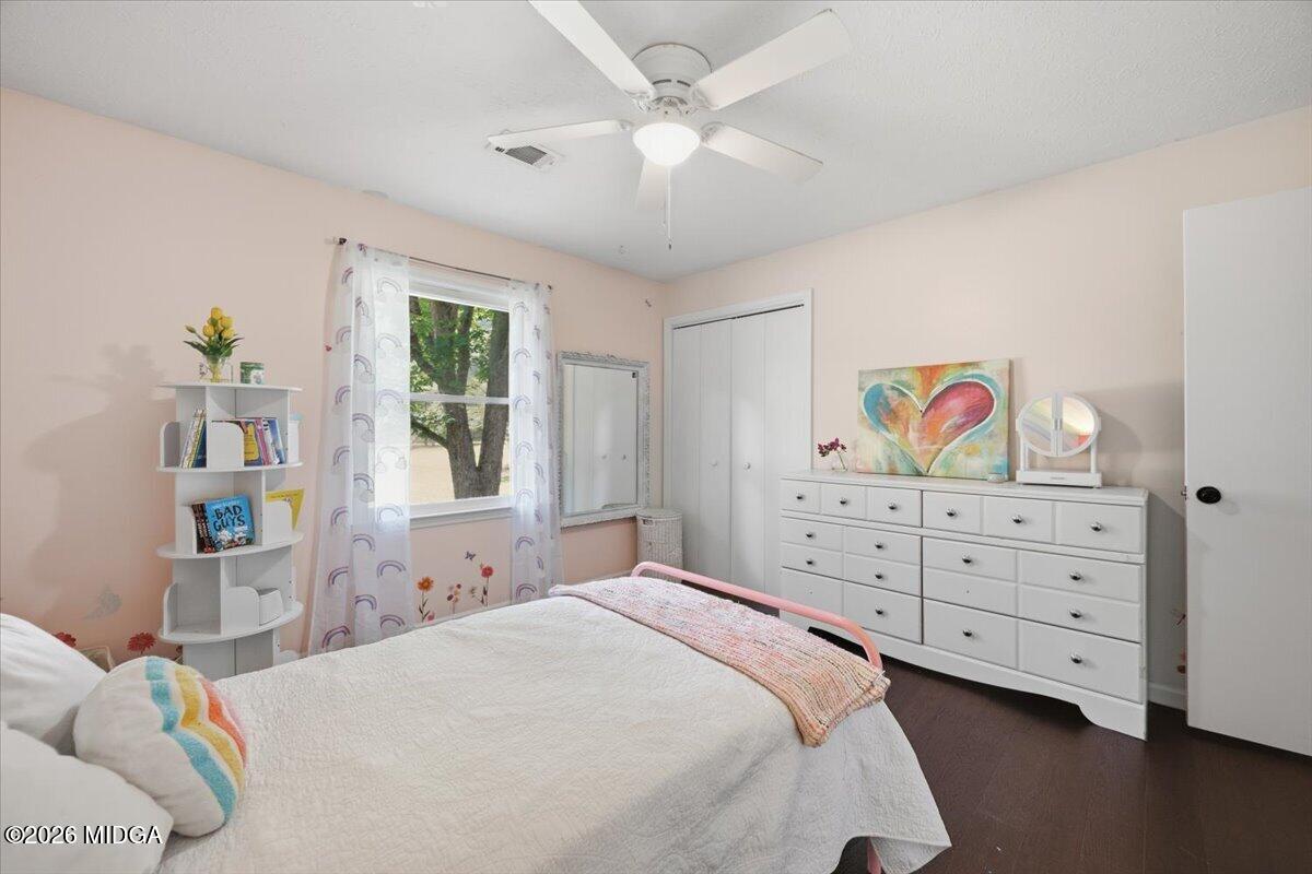 1608 Rumble Road Forsyth, GA 31029 - Photo 25 of 46 a bedroom with a bed and a dresser