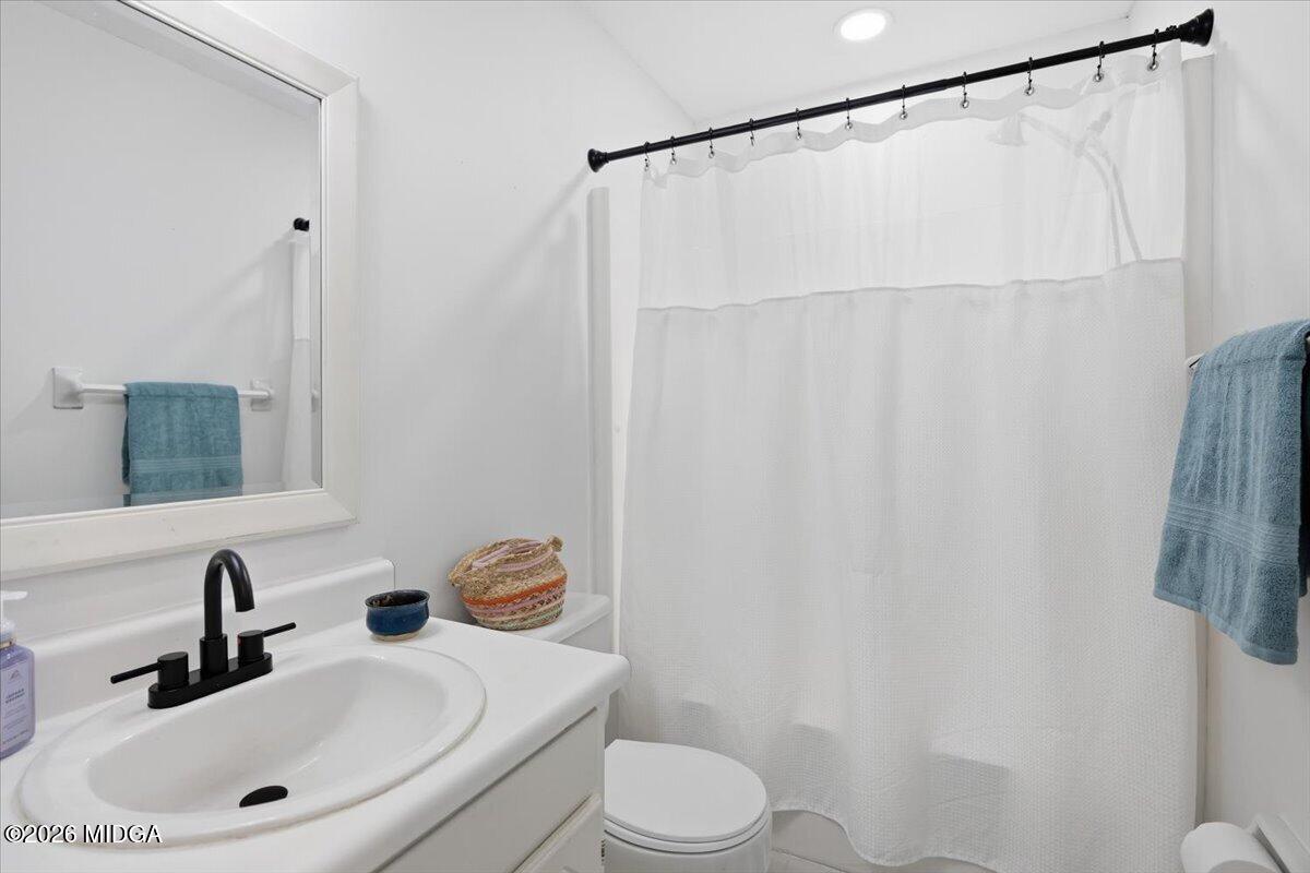 1608 Rumble Road Forsyth, GA 31029 - Photo 26 of 46 a bathroom with a sink and a mirror