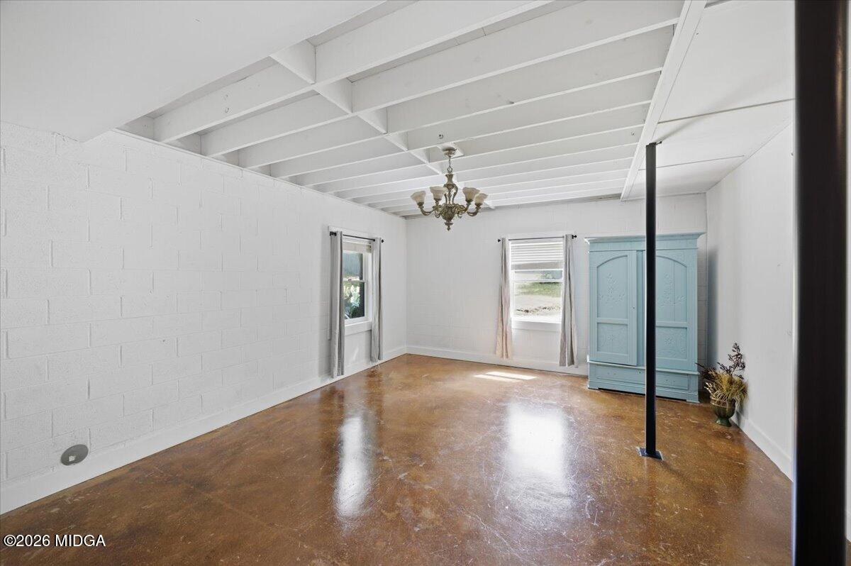 1608 Rumble Road Forsyth, GA 31029 - Photo 27 of 46 a view of a livingroom with a ceiling fan and window