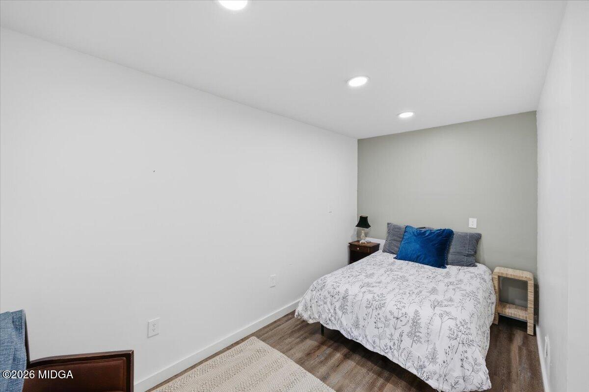 1608 Rumble Road Forsyth, GA 31029 - Photo 28 of 46 a bedroom with a bed and a night stand