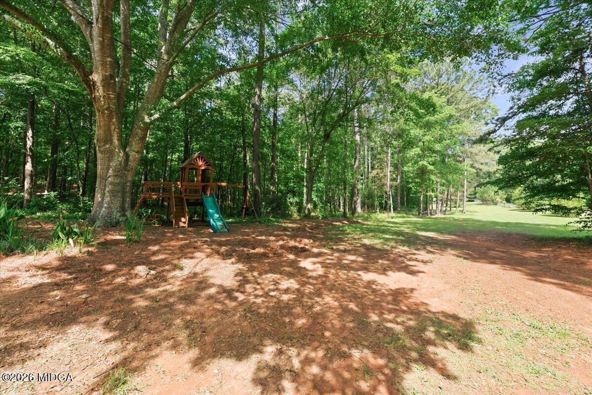 1608 Rumble Road Forsyth, GA 31029 - Photo 40 of 46 a backyard of a house with lots of green space