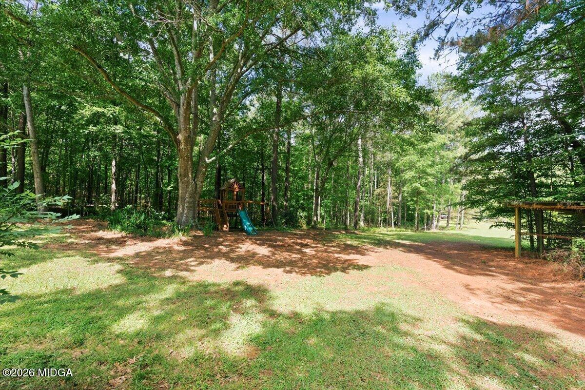 1608 Rumble Road Forsyth, GA 31029 - Photo 45 of 46 a view of a yard with a tree