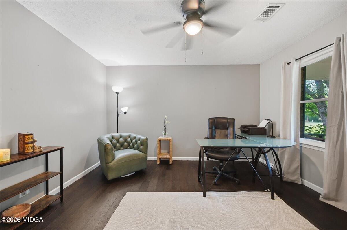 1608 Rumble Road Forsyth, GA 31029 - Photo 5 of 46 a livingroom with workspace and a couch