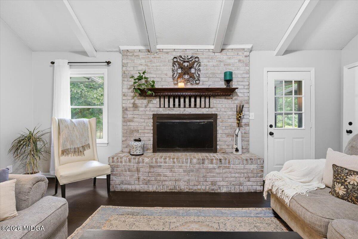 1608 Rumble Road Forsyth, GA 31029 - Photo 9 of 46 a living room with furniture and a fireplace