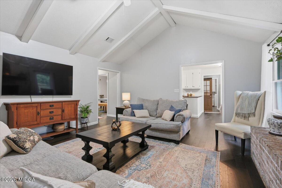 1608 Rumble Road Forsyth, GA 31029 - Photo 10 of 46 a living room with furniture and a flat screen tv