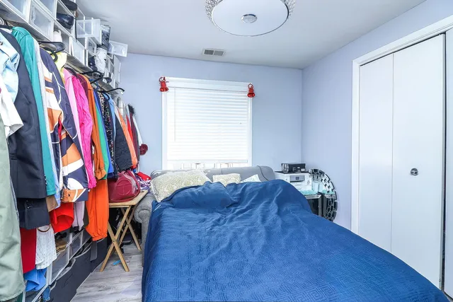 a very nice looking room with a bed and a window