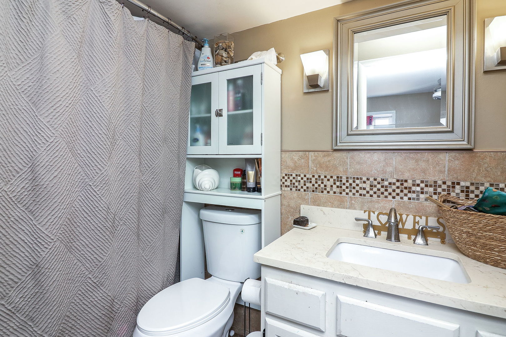 6337 Roosevelt Road, Unit 309 Berwyn, IL 60402 - Photo 9 of 16 a bathroom with a sink and a toilet