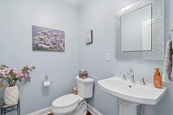 a bedroom with a bed couch and a window