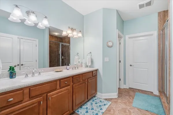 a bathroom with a sink and mirror